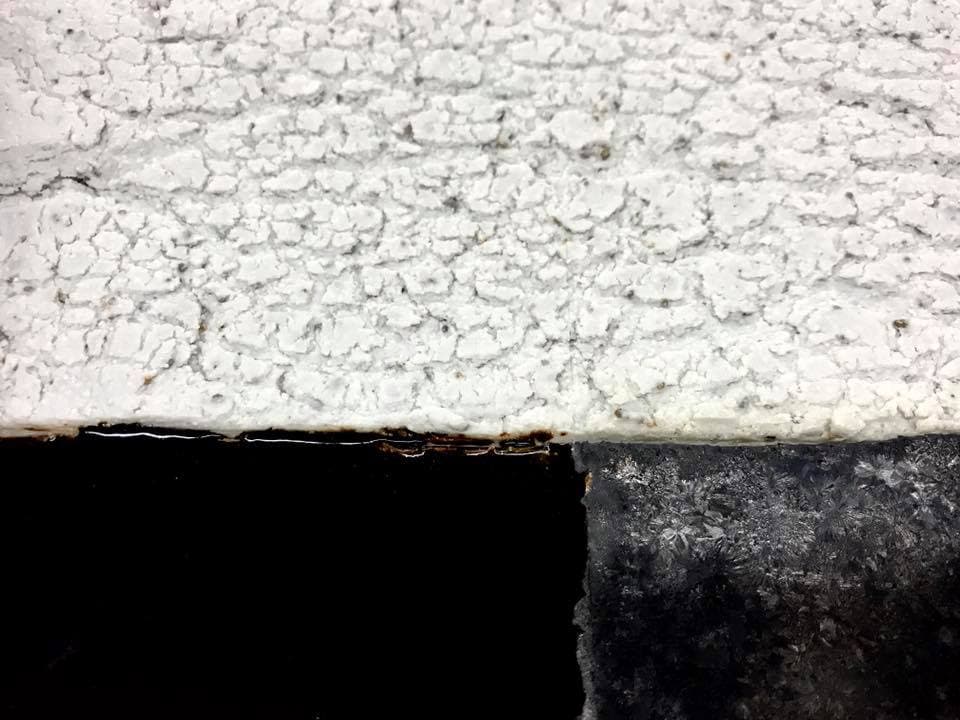 Image of a white, black, and dark grey sculpture by Eleanor Cepko.