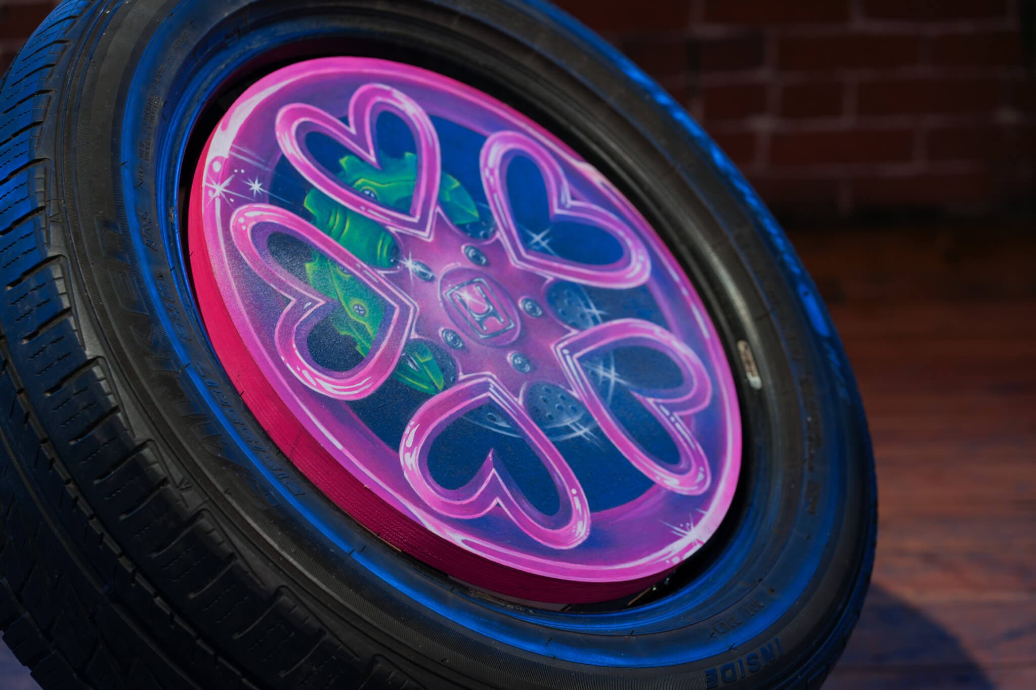 Hearts spray painted on a tire.